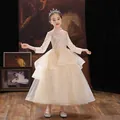 Elegant champagne flower girl gown with long sleeves and shimmering sequin bodice detail - 120cm / Champagne Long Sleeve