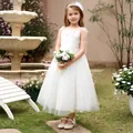 Close-up of white star sequin tulle on a puffy princess flower girl dress for children - Beige / 2-3Y