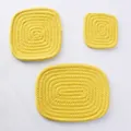 Detail showing bright yellow cotton woven heat-resistant coasters in square and oval shapes - 20x15cm / Bright Yellow