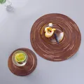 Detailed top view of handmade round woven placemats in a Nordic minimalist dining scene - Brown Satin Dye