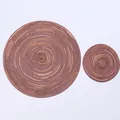 Detail of round woven ramie placemats showing spiral texture and brown gradient tones - 18cm / Brown Series