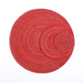 Detail of red and silver round woven placemats in three nested sizes for dining decor - Red