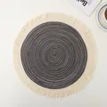 Close-up of circular woven ramie placemat with gray spiral pattern and fringe trim - Dark Gray with Tassel