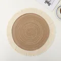 Detailed top view of a circular woven ramie placemat with rustic brown center and cream tassels - Brown Tassel