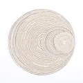 Detailed macro of woven round placemats in beige and light coffee cotton fiber - Beige