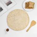 Close-up of hand-woven round seagrass placemat with spiral texture on white table - Diameter 38cm / No.3 Natural Corn Husk