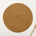 Close-up of brown round ramie placemat with detailed spiral woven texture and a gold fork - Solid Earthy Yellow