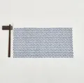 Detail of rectangular woven placemat with blue geometric pattern and white fabric - White and Royal Blue