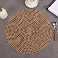 Minimalist round jute woven placemat with hollow mesh texture on a stone table - 38cm / Brown