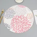 Detail of round woven placemat featuring elegant pink and purple floral patterns - Pattern 3
