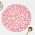 Pink round woven table mat with hollow mesh texture for heat insulation and decoration - Round / Pink