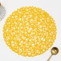 Bright yellow round woven placemat with intricate hollow mesh design for dining table decor - Round / Bright Yellow