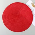 Round bright red woven placemat with spiral pattern on light grey background - Bright Red