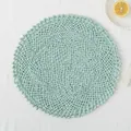 Handwoven mint green round placemat with spiral fiber texture and fringe details - Sawtooth Clear Blue