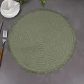Overhead view of sage green woven placemat with delicate fringe on a stone surface - 38cm / Green
