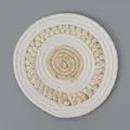 Close-up of a round woven coaster made of natural straw and white cotton rope material - 22cm