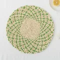 Handwoven circular placemat with fringe details in white and green spiral patterns - Sawtooth Green Two-Tone