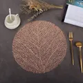 Detail of rose gold hollow PVC round placemat with elegant coral leaf texture on marble - Leaves (Rose Gold)