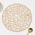 Handcrafted round woven placemat in light gold finish with artistic openwork design - Round / Champagne Gold