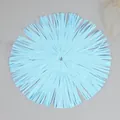 Detailed top view of a light blue round woven paper placemat with fringe for table decor - Diameter 30 / Blue