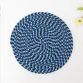 Top view of a round hand-woven table mat with blue and white spiral pattern detail - Round 11cm / Navy Mixed