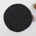Handwoven black round placemat with spiral texture and fringe for elegant dining table decor - Black