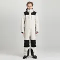 Kids one-piece ski suit in white and black patchwork with waterproof thick fabric - 130 / Beige