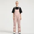 Women's pink waterproof insulated ski bib overalls with adjustable straps for snow sports - S / Bottoms / Pink