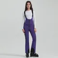 Women's professional purple waterproof ski bib with adjustable straps and reinforced ankles - XS / Bottoms / Purple