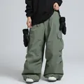 Grayish green oversized cargo ski pants for men and women featuring multi-pocket design - XS / Bottoms / Army Green