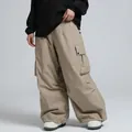 Loose fit khaki waterproof ski pants for men and women with functional side cargo pockets - XS / Bottoms / Khaki