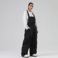 Waterproof black bib ski pants with adjustable straps and loose fit for winter outdoor sports - XS / Bottoms / Black
