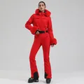 Slim fit red one-piece women's ski suit with fur hood and adjustable black belt - M / Top And Bottom / Red
