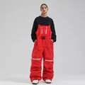 Women's professional red waterproof ski bib overall with black adjustable shoulder straps - XS / Red