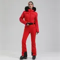 Women's professional red ski suit with fur hood and black belt in a slim fit - M / Top And Bottom / Red