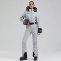 Slim-fit light grey one-piece ski suit with fur-trimmed hood and black waist belt - XS / Top And Bottom / Light Gray