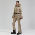 Slim fit beige one-piece ski suit for women with fluffy fur hood and adjustable belt - XS / Khaki