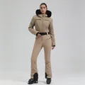 Women's beige ski suit featuring a textured woven jacket with a black faux fur hood - Dark Khaki