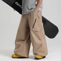Waterproof khaki loose fit ski pants for men and women featuring side zipper pockets - XS / Khaki