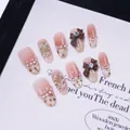 Ongles faits main dégradés nude avec nœuds 3D, perles et accents de strass - Ballerine Moyenne (C71-XS)