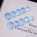 Cat eye short press-on nails in light blue with white flower patterns and pearls - XS / Short Round Square