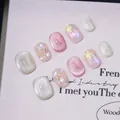 Handmade pink cat-eye press-on nails set with 3D floral designs and glitter finish - XS