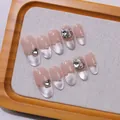 Handgemaakte amandel plaknagels met Frans cat-eye design, strassteentjes en strikjes - XS / Ovale vorm