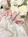Detail of luxury almond fake nails with cat eye effect and large 3D clear rhinestones - XS / Crescent Moon Long Almond