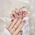 Handmade cat eye press-on nails with grey magnetic finish and rhinestone accents - XS