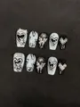 Detail of 3D metallic bear and butterfly charms on black and white press-on nails - XS / Black White Silver