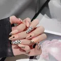Handmade leopard print press-on nails in peach pink with 3D black dotted accents - XS / Leopard Almond