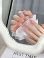 Close-up of nude pink gradient press-on nails with silver rhinestones and pearls - XS / Pink (F30) Dancing