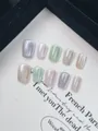 Macro detail of 10pcs handmade rainbow cat-eye press-on nails in pastel macaron shades - XS / Fruit Hard Candy Cat Eye
