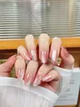 Macro detail of cat-eye gradient press-on nails with sparkling rhinestones and micro beads - XS / Short Oval Shape / Pink Purple